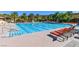 Enjoy this large swimming pool with plenty of seating and palm tree views at 11 Feather Sound Dr, Henderson, NV 89052