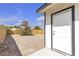 The backyard is enclosed by a wood fence and features a white exterior door at 1424 Balzar Ave, Las Vegas, NV 89106