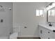 This updated bathroom features a shower and modern vanity with ample storage at 1424 Balzar Ave, Las Vegas, NV 89106