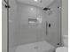This bathroom offers a tiled shower with modern fixtures and glass surround at 1424 Balzar Ave, Las Vegas, NV 89106