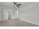 Neutral bedroom features a ceiling fan, doors to closet and en-suite at 1424 Balzar Ave, Las Vegas, NV 89106