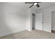 The bedroom features neutral carpet, ceiling fan, and closet for storage at 1424 Balzar Ave, Las Vegas, NV 89106