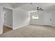 Serene bedroom with plush carpeting, ceiling fan, and ample natural light at 1424 Balzar Ave, Las Vegas, NV 89106