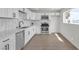 Modern kitchen with stainless appliances, stylish white cabinets, and a backsplash at 1424 Balzar Ave, Las Vegas, NV 89106