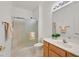 Bathroom featuring a shower, toilet, sink with wood cabinets, and towel rack at 1846 High Mesa Dr, Henderson, NV 89012