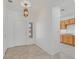 Bright foyer with tile flooring, decorative lighting, and views into kitchen at 1846 High Mesa Dr, Henderson, NV 89012
