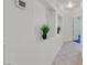 Bright white hallway with tile flooring and decor niches at 1846 High Mesa Dr, Henderson, NV 89012