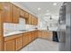 View of the Kitchen with wooden cabinets and stainless steel refrigerator at 1846 High Mesa Dr, Henderson, NV 89012