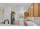 Spacious kitchen featuring wooden cabinets and stainless steel refrigerator at 1846 High Mesa Dr, Henderson, NV 89012