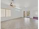 Spacious living room with tile flooring, a ceiling fan, and natural light at 1846 High Mesa Dr, Henderson, NV 89012