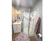 Well-lit bathroom with a corner shower and white vanity at 2171 Bay Club Dr # 103, Laughlin, NV 89029