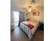 Cozy bedroom with balcony access, neutral decor, and a ceiling fan at 2171 Bay Club Dr # 103, Laughlin, NV 89029