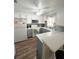 Well-lit kitchen with white cabinets, white appliances and a bright window at 2171 Bay Club Dr # 103, Laughlin, NV 89029