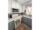 Well-equipped kitchen with modern microwave, white appliances, and tile backsplash at 2171 Bay Club Dr # 103, Laughlin, NV 89029