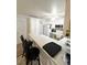 Inviting kitchen features eat in bar, a view of the appliances and white cabinets at 2171 Bay Club Dr # 103, Laughlin, NV 89029