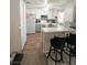 Eat in kitchen with stools, white cabinets and appliances at 2171 Bay Club Dr # 103, Laughlin, NV 89029