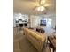 Inviting living room featuring neutral carpet, fan, and a view into the kitchen and an outdoor view at 2171 Bay Club Dr # 103, Laughlin, NV 89029
