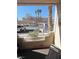 Cozy patio view overlooking the community parking and palm trees at 2171 Bay Club Dr # 103, Laughlin, NV 89029