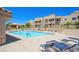 Community pool area with plenty of lounge chairs for relaxing at 2171 Bay Club Dr # 103, Laughlin, NV 89029