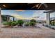 Beautiful backyard patio area with manicured landscaping, pavers, and gorgeous desert views at 2180 Skyline Heights Ln, Henderson, NV 89052