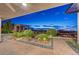 Expansive backyard featuring desert landscaping, an open-air pergola, and city views at 2180 Skyline Heights Ln, Henderson, NV 89052
