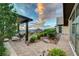 Stunning backyard and desert landscape, featuring an outdoor seating area with pavers at 2180 Skyline Heights Ln, Henderson, NV 89052
