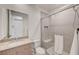 Modern bathroom featuring a glass shower, neutral tile, and sleek vanity at 2180 Skyline Heights Ln, Henderson, NV 89052