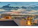 A panoramic view of the city skyline at dusk from a rooftop terrace at 2180 Skyline Heights Ln, Henderson, NV 89052
