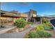 Stunning modern home with exquisite desert landscaping and an outdoor seating area at 2180 Skyline Heights Ln, Henderson, NV 89052