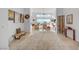Bright foyer leading to a spacious living room with modern decor and floor-to-ceiling windows at 2180 Skyline Heights Ln, Henderson, NV 89052