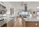 Modern kitchen with stainless appliances, white countertops, and an open layout, perfect for cooking and entertaining at 2180 Skyline Heights Ln, Henderson, NV 89052