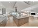 Contemporary kitchen showcasing a large island, stainless appliances, and hardwood floors, ideal for culinary enthusiasts at 2180 Skyline Heights Ln, Henderson, NV 89052