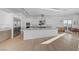 Elegant kitchen with a large island, stainless steel appliances, and hardwood floors, creating a modern and inviting space at 2180 Skyline Heights Ln, Henderson, NV 89052