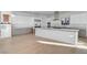 Spacious kitchen boasts stainless steel appliances, modern cabinetry, and a generous island, blending style and functionality at 2180 Skyline Heights Ln, Henderson, NV 89052