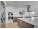 Contemporary kitchen featuring sleek cabinetry, stainless steel appliances, and a spacious quartz countertop island at 2180 Skyline Heights Ln, Henderson, NV 89052