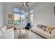 Bright living room featuring ample windows, mountain views, and modern decor at 2180 Skyline Heights Ln, Henderson, NV 89052