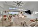 Bright and airy living room with a modern design, plush seating, and open patio doors at 2180 Skyline Heights Ln, Henderson, NV 89052