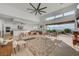 Open-concept living area featuring modern decor, sleek furniture, and access to a scenic outdoor patio at 2180 Skyline Heights Ln, Henderson, NV 89052