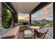 Outdoor seating area with lush landscaping and scenic views at 2180 Skyline Heights Ln, Henderson, NV 89052