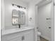 Bathroom featuring modern vanity, faucet, and light fixture in a neutral color palette at 2504 Paradise Village Way, Las Vegas, NV 89120