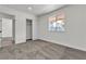 Bedroom featuring an exterior view, carpet, and closet with sliding doors at 2504 Paradise Village Way, Las Vegas, NV 89120