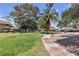 Beautifully landscaped community grounds with lush green lawns, mature trees, and walking paths at 2504 Paradise Village Way, Las Vegas, NV 89120