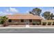 Charming single-story home featuring a traditional red tile roof, desert landscaping, and a well-maintained exterior at 2504 Paradise Village Way, Las Vegas, NV 89120