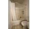 This bathroom has a shower and tub combination, a toilet, and a shower curtain at 251 S Green Valley Pkwy # 721, Henderson, NV 89012