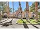 Community clubhouse featuring manicured lawns, palm trees, and ample parking at 251 S Green Valley Pkwy # 721, Henderson, NV 89012