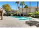 Beautiful community pool with loungers, set amid lush greenery and palm trees, offering a resort-like experience at 251 S Green Valley Pkwy # 721, Henderson, NV 89012