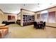 Cozy community room with bookshelves, tables, and comfortable seating, ideal for gatherings and relaxation at 251 S Green Valley Pkwy # 721, Henderson, NV 89012