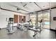 Well-equipped gym with large windows, treadmills, elliptical, and stationary bike at 251 S Green Valley Pkwy # 721, Henderson, NV 89012