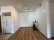 Bright living room with wood-look floors, white walls, and track lighting, great for flexible living at 251 S Green Valley Pkwy # 721, Henderson, NV 89012