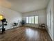 This living room has wood flooring, natural light, and is decorated with plants to create a warm atmosphere at 251 S Green Valley Pkwy # 721, Henderson, NV 89012